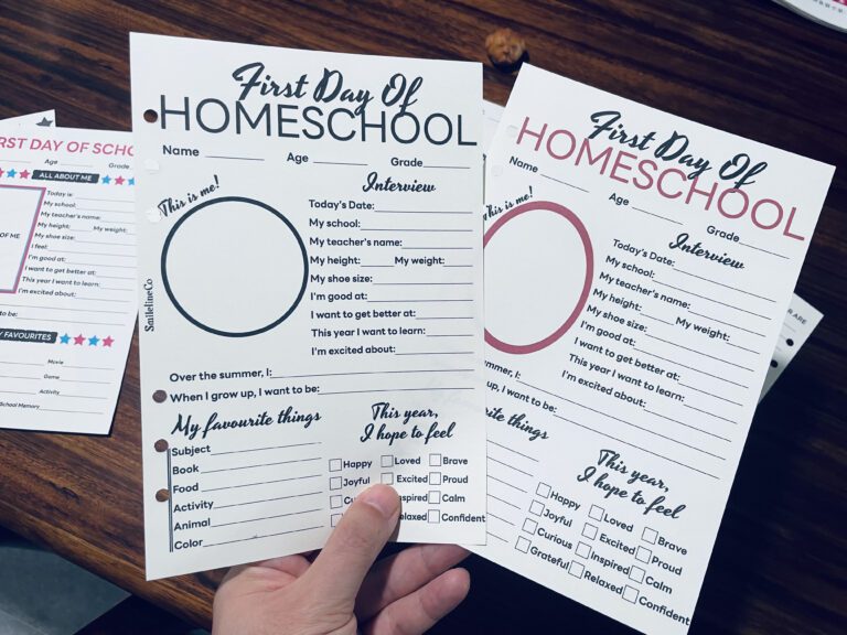 Calm flat lay of two homeschool first-day keepsake pages side by side on wood