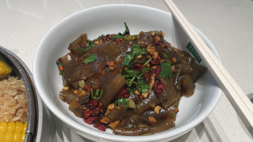 Stir-fried glass noodle sheets with pickled mustard greens