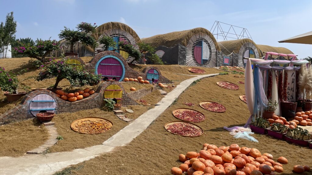 Harvest-themed village with vegetables and autumn decorations at Huaguoyuan Farm