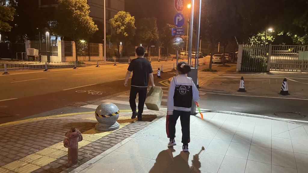 My daughter and her father walking together at dusk to say goodbye to their little duck