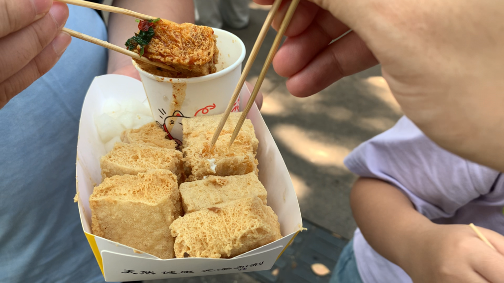 White stinky tofu in China, a large portion of nine fried pieces with sauce