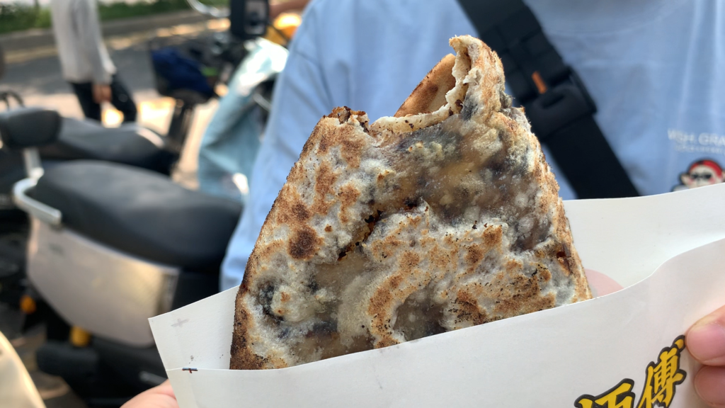 Master Shao’s meicai kourou pie, a Chinese street food pie filled with braised pork belly and preserved greens