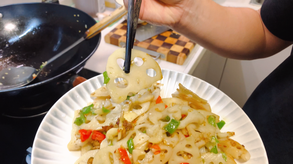 Spicy lotus root slices stir-fried for a Hunan home cooking dinner