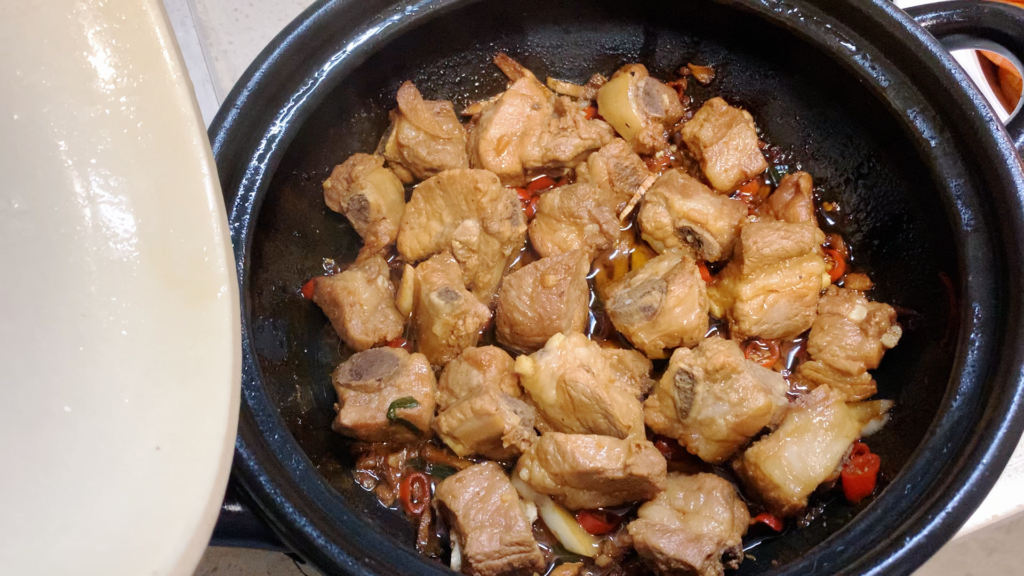 Cooking a birthday dinner in China in a wok on the stove - 1