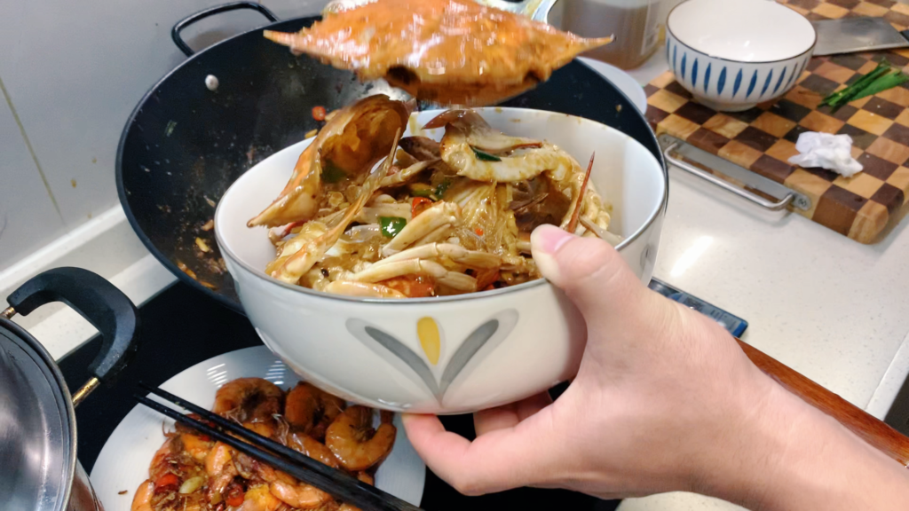 Cooking a birthday dinner in China in a wok on the stove -3